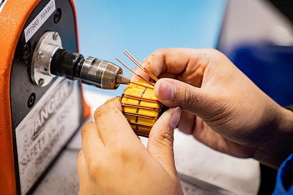 WCM technician winding low-AC-loss foil for a power inductor